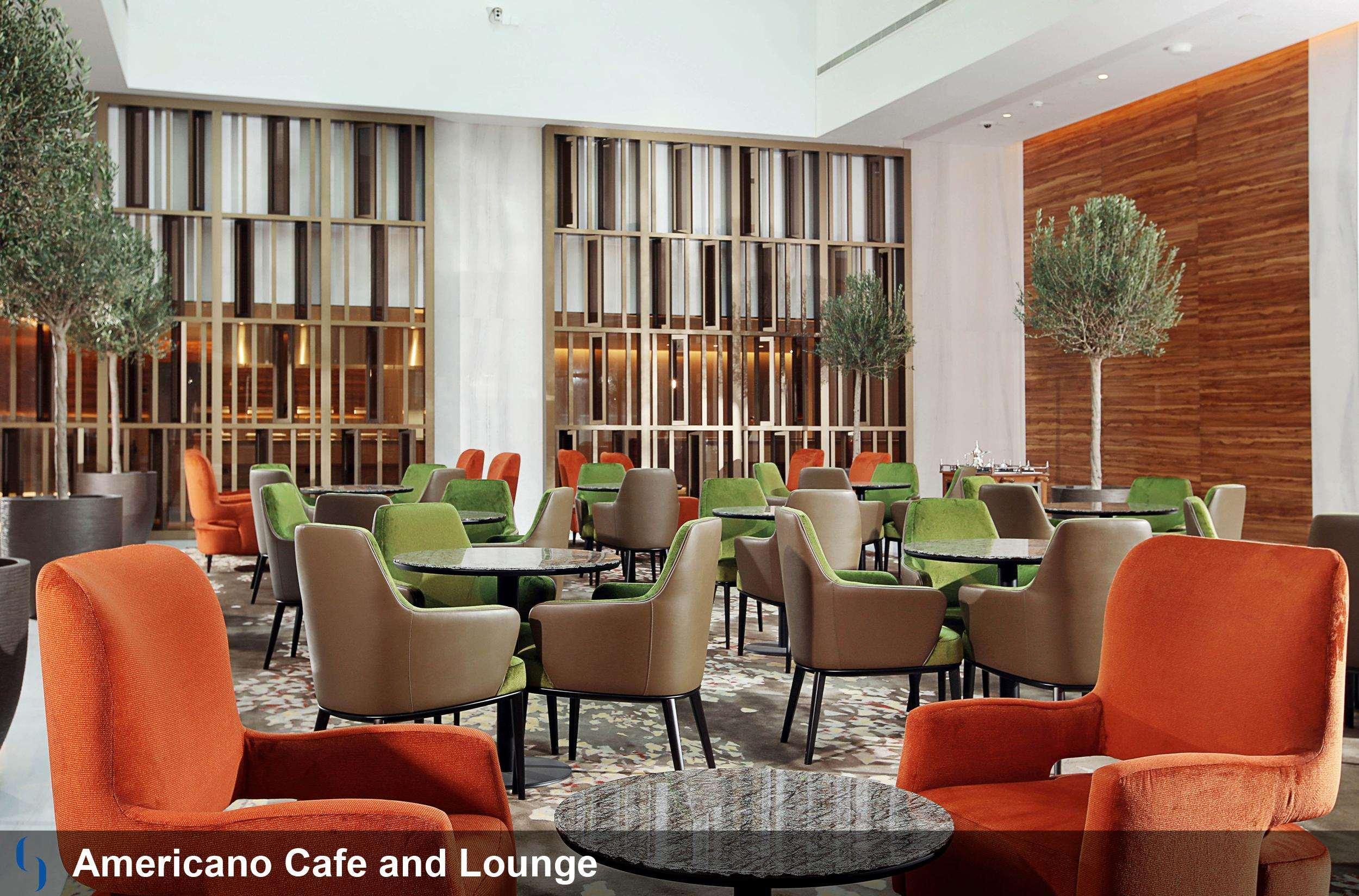 Grand Cosmopolitan Hotel Dubai Exterior foto The image shows a modern café and lounge area called "Americano Café and Lounge." The interior features a spacious, well-lit design with a mix of stylish furniture. There are several seating areas with comfortable chairs in various colors, including 