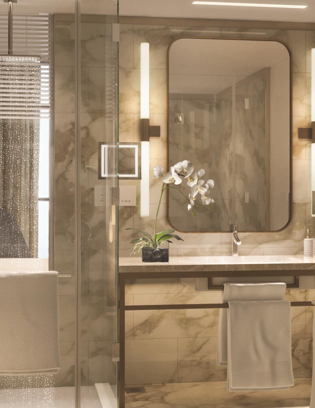 Grand Cosmopolitan Hotel Dubai Exterior foto The photo shows a modern bathroom featuring elegant design elements. There is a large mirror above a stylish vanity with a light-colored countertop. A decorative orchid plant is placed on the vanity, adding a touch of nature. The bathroom has glass d